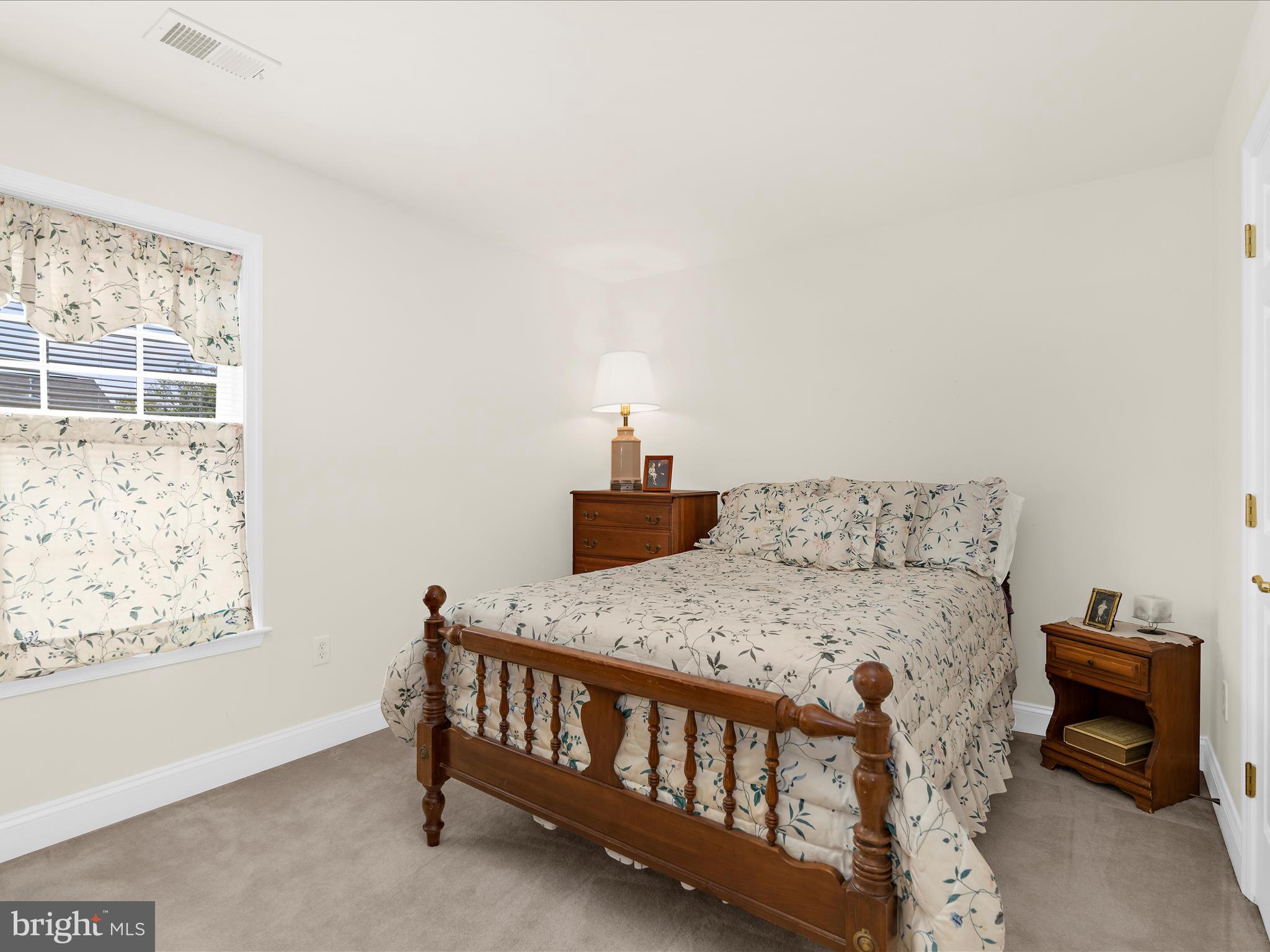 7659 Porcelain Tile Court Odenton, MD 21113 - Photo 23 of 49 a bedroom with a bed and wooden floor
