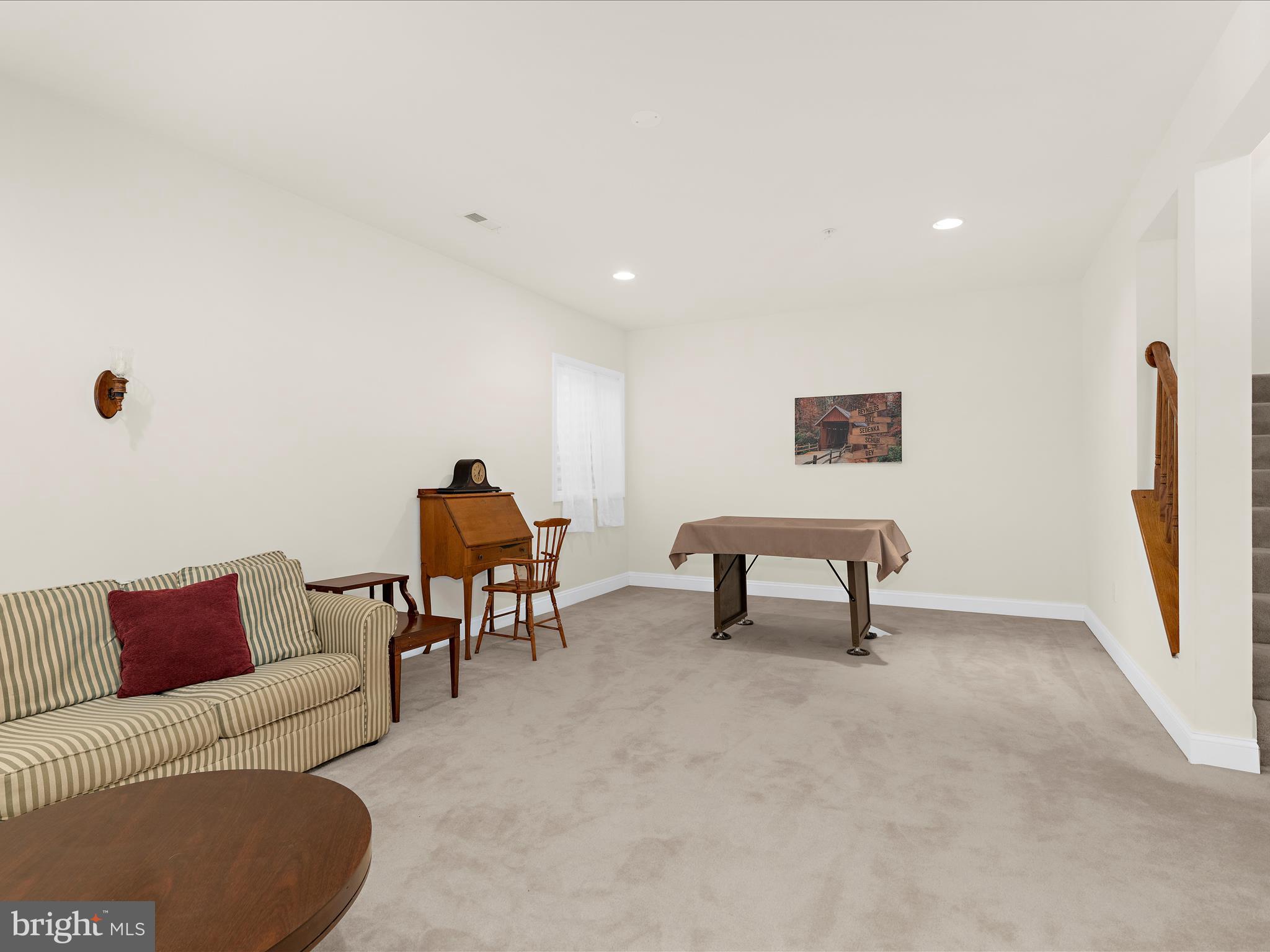 7659 Porcelain Tile Court Odenton, MD 21113 - Photo 29 of 49 a living room with furniture and a window