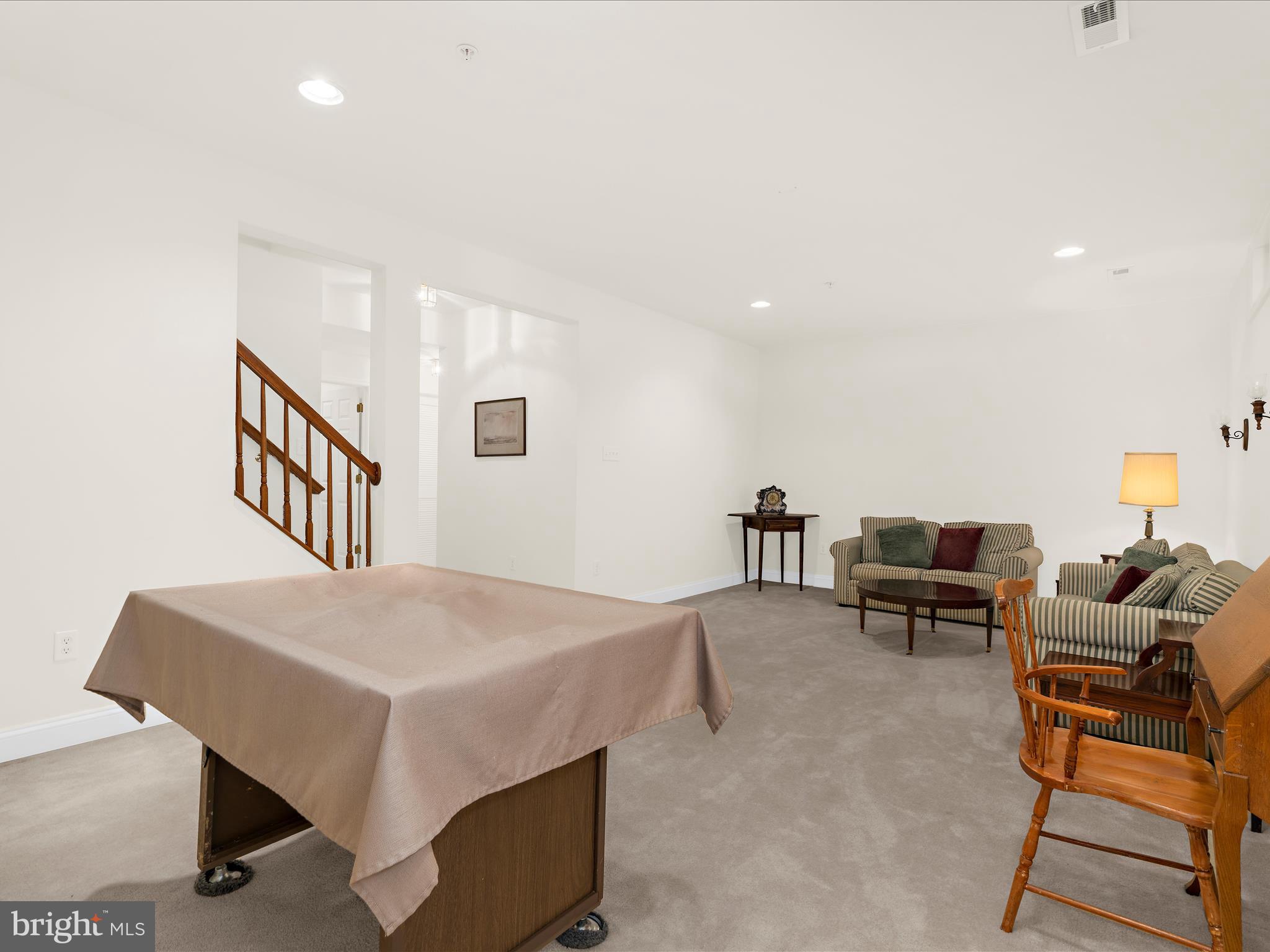 7659 Porcelain Tile Court Odenton, MD 21113 - Photo 30 of 49 a living room with furniture and a table