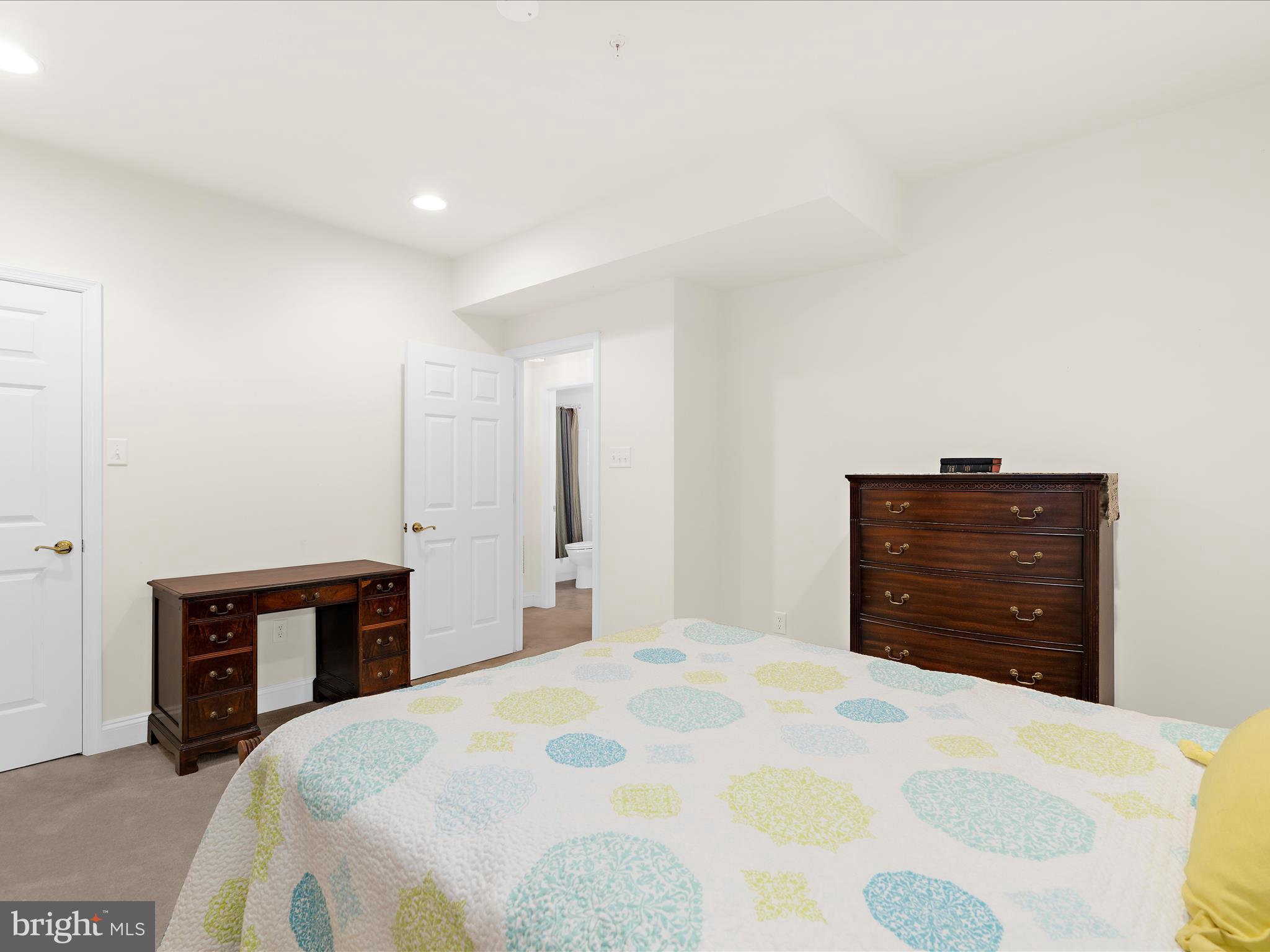 7659 Porcelain Tile Court Odenton, MD 21113 - Photo 32 of 49 a bedroom with a bed and a dresser