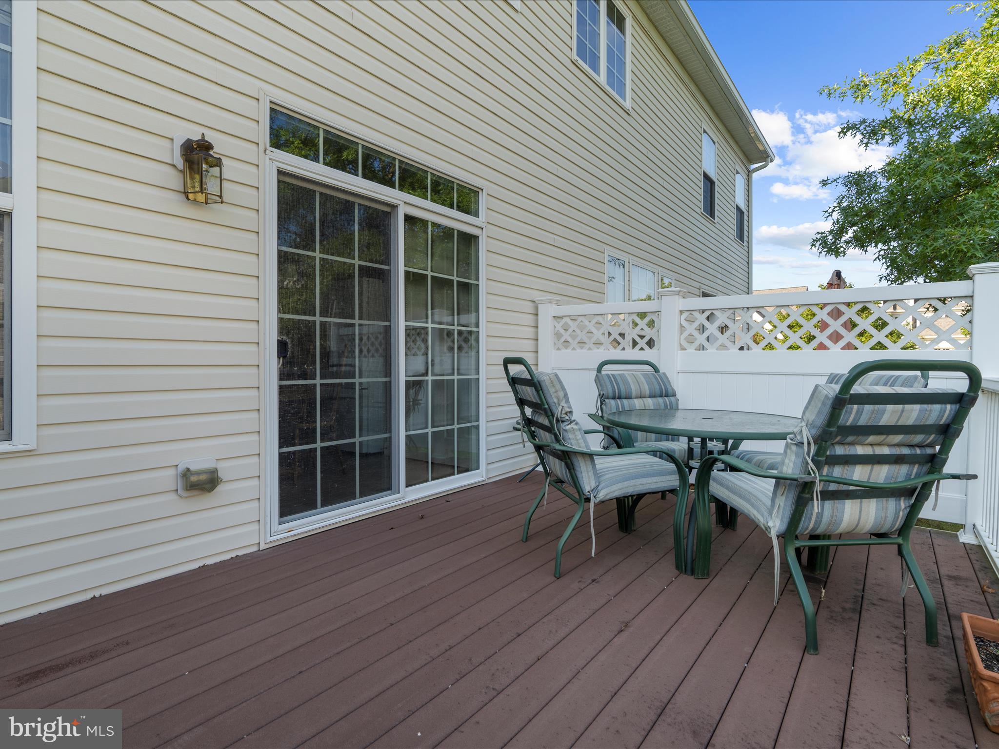 7659 Porcelain Tile Court Odenton, MD 21113 - Photo 38 of 49 a view of a roof deck with table and chairs and wooden floor
