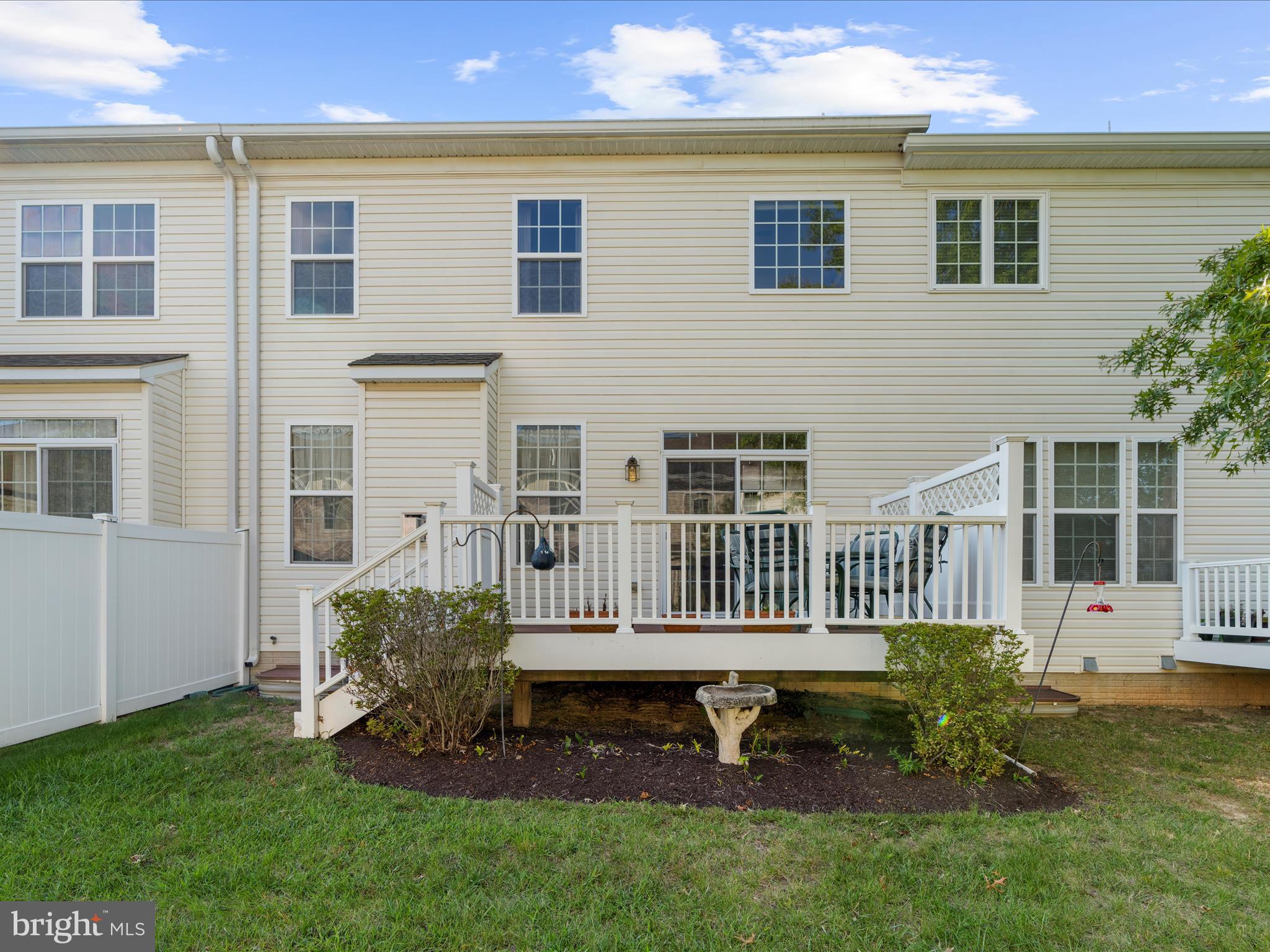 7659 Porcelain Tile Court Odenton, MD 21113 - Photo 40 of 49 a view of a house with a yard and deck