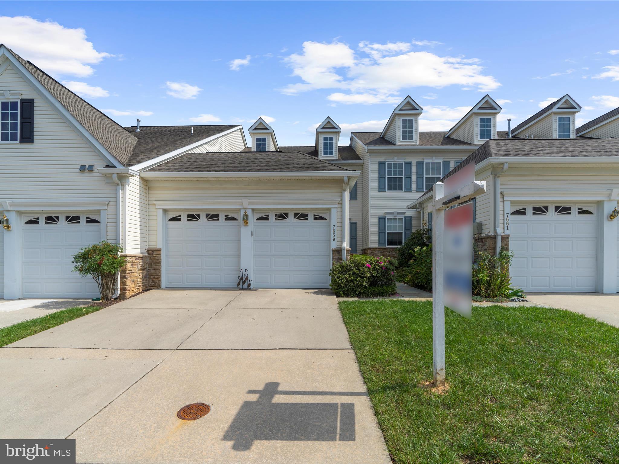 7659 Porcelain Tile Court Odenton, MD 21113 - Photo 41 of 49 a front view of a house with a yard
