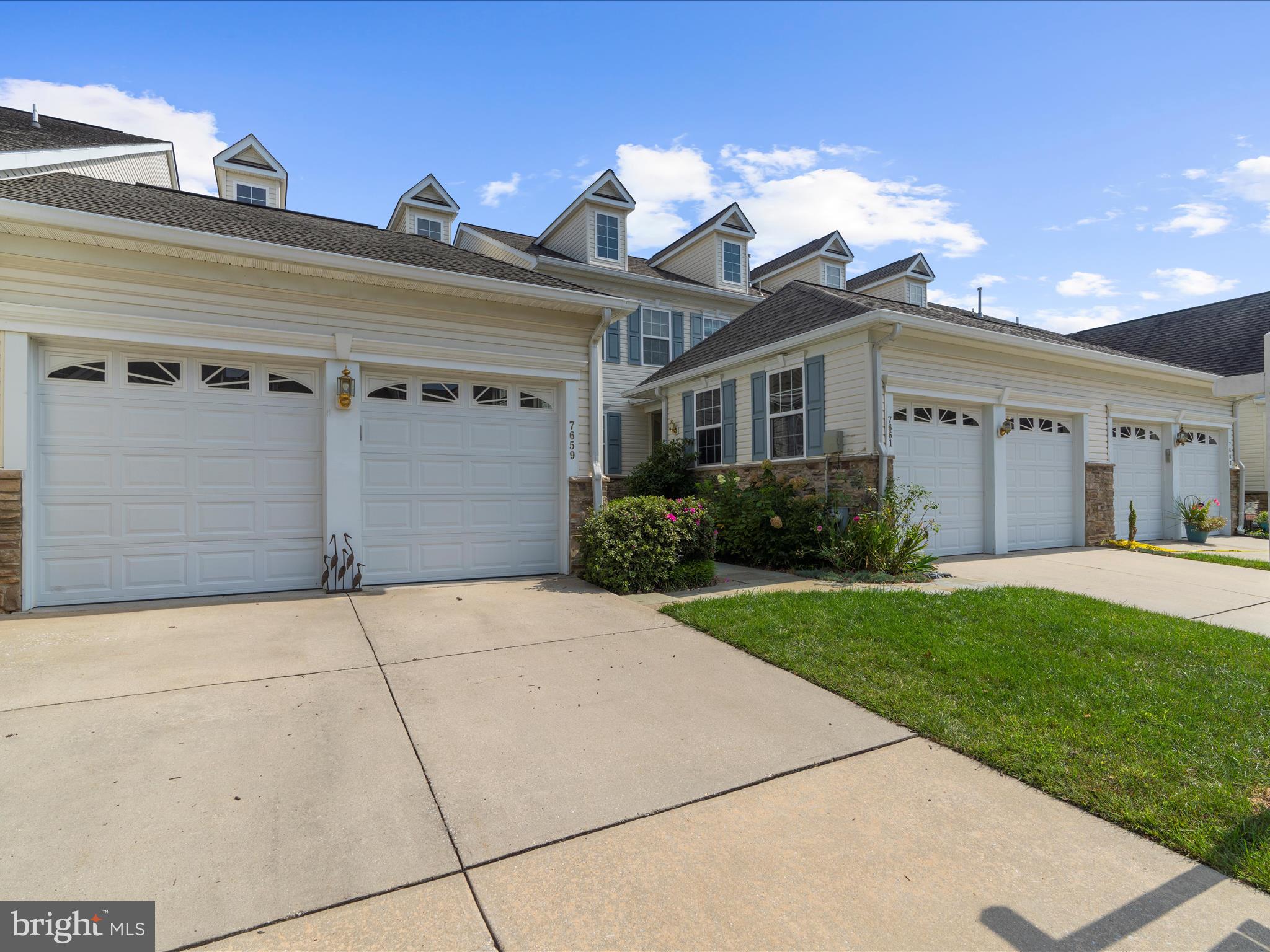 7659 Porcelain Tile Court Odenton, MD 21113 - Photo 42 of 49 a view of a house with a yard and potted plants