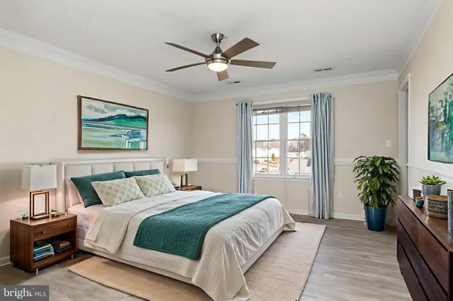 a bedroom with a large bed and a window