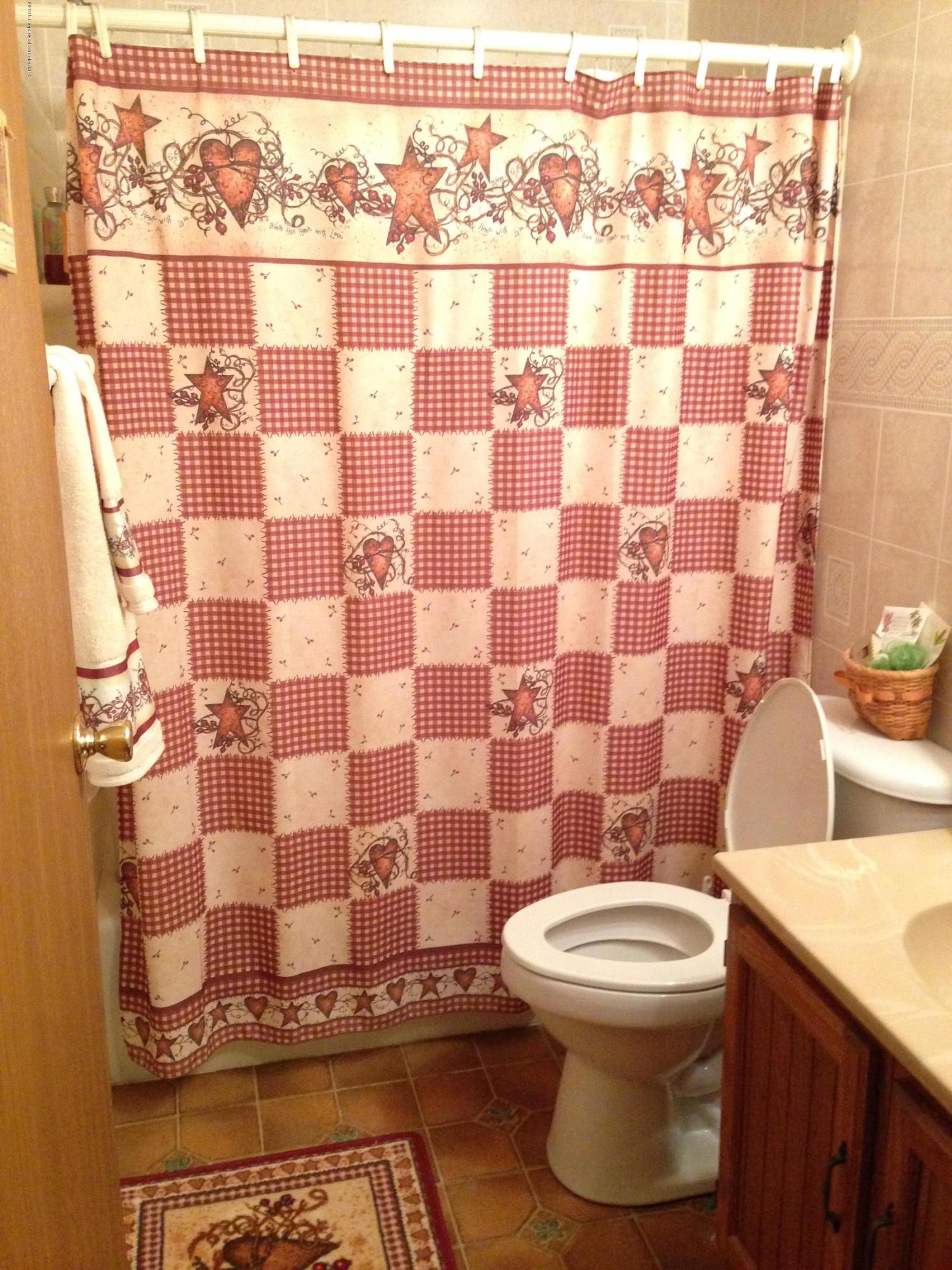 94 Depot Road Kingsley, PA 18826 - Photo 15 of 27 a bathroom with a sink toilet and shower