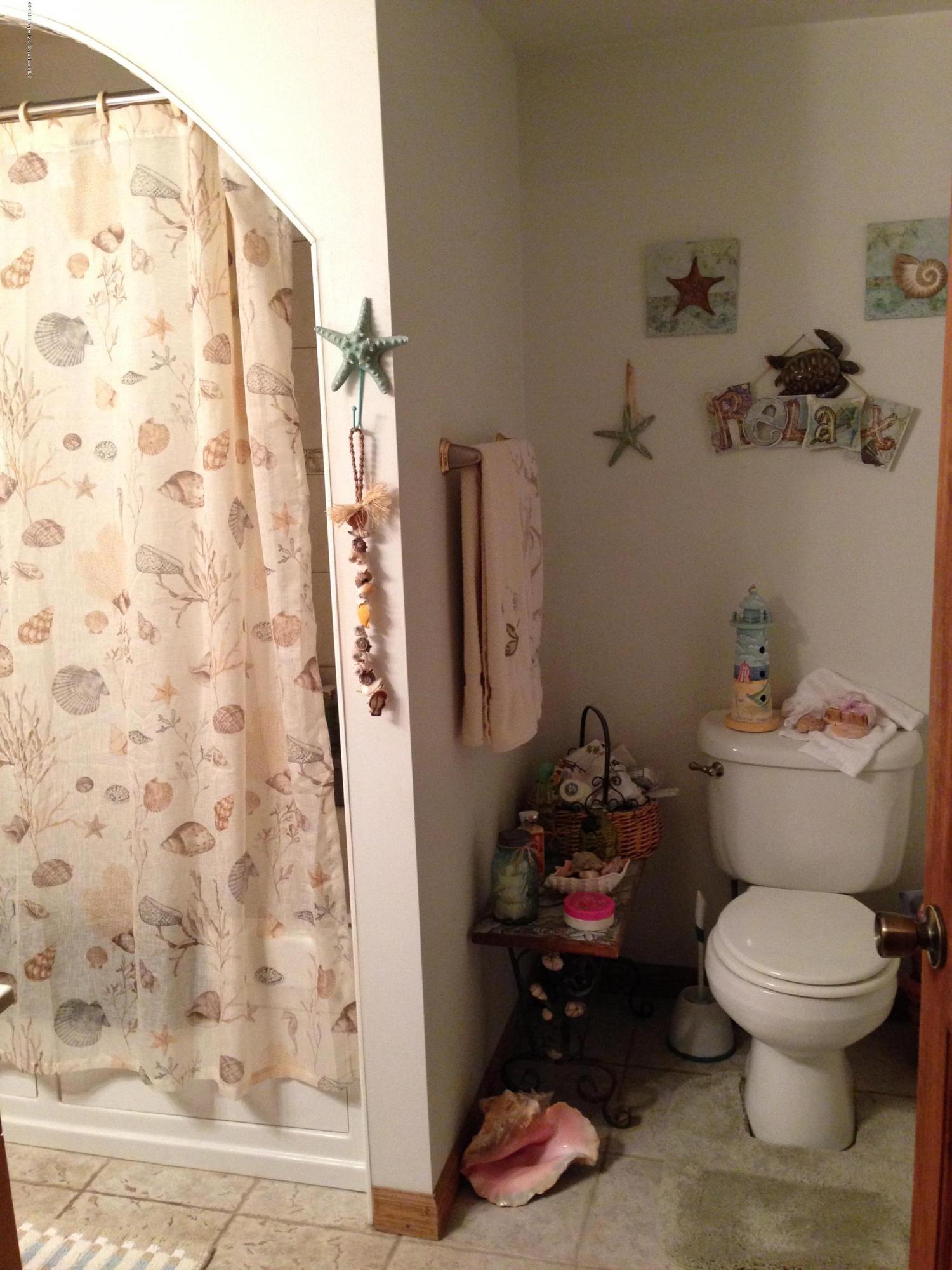 94 Depot Road Kingsley, PA 18826 - Photo 7 of 27 a bathroom with a toilet and a shower curtain