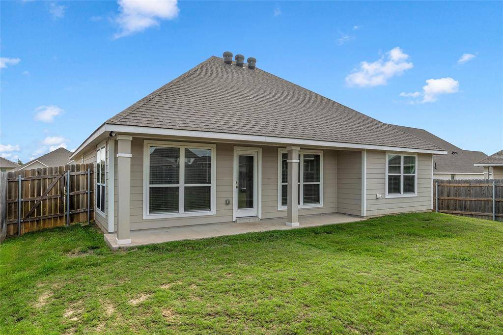 3213 Dottavio Road Lorena, TX 76655 - Photo 30 of 32 a front view of a house with a garden and yard