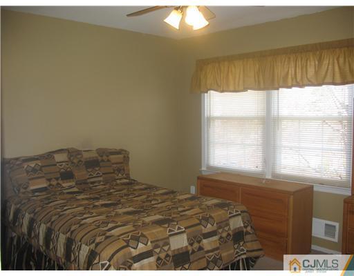 6 Sinclair Road Edison, NJ 08820 - Photo 12 of 14 a bedroom with a bed and a window