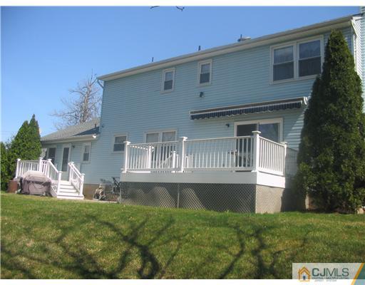 6 Sinclair Road Edison, NJ 08820 - Photo 3 of 14 a front view of a house with a yard