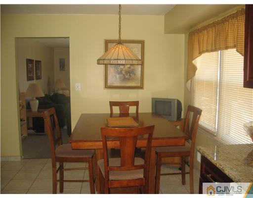 6 Sinclair Road Edison, NJ 08820 - Photo 6 of 14 a view of a dining room with furniture and window