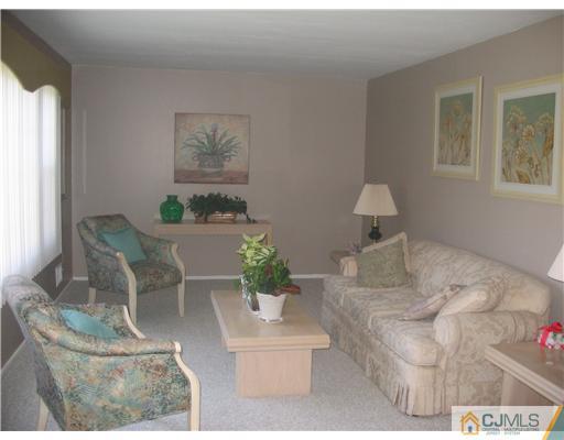 6 Sinclair Road Edison, NJ 08820 - Photo 10 of 14 a living room with furniture and a window