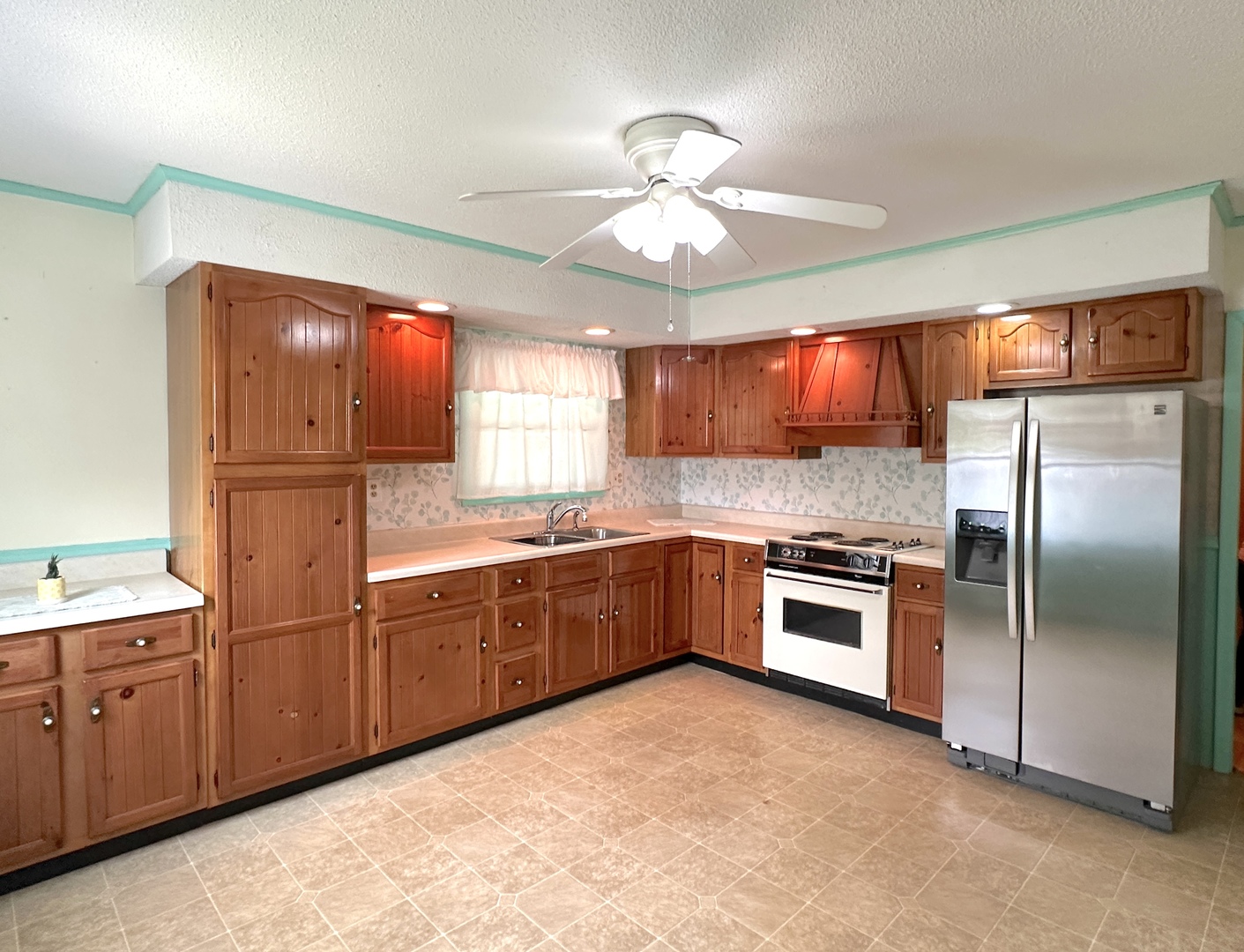 106 George Street Hurst, IL 62949 - Photo 4 of 14 a kitchen with stainless steel appliances granite countertop a refrigerator a sink dishwasher a stove with wooden cabinets and floor