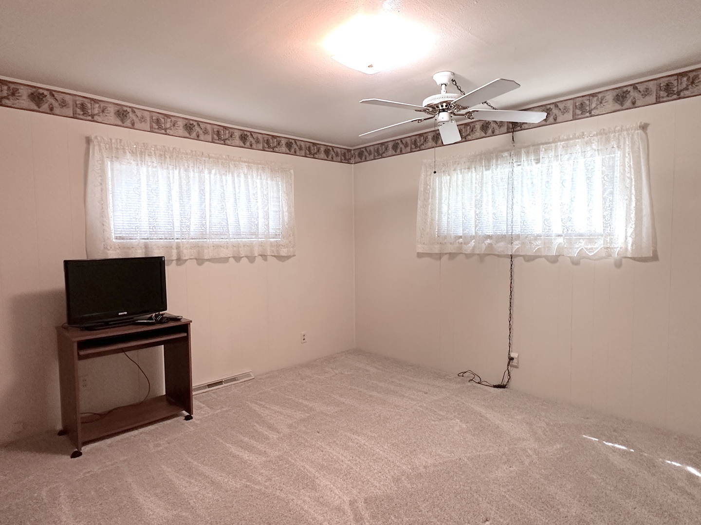 106 George Street Hurst, IL 62949 - Photo 6 of 14 a view of a livingroom with a flat screen tv and a window
