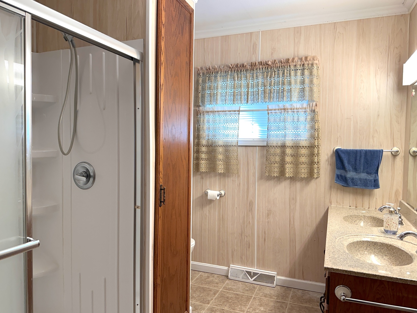 106 George Street Hurst, IL 62949 - Photo 9 of 14 a bathroom with a sink a glass door and shower