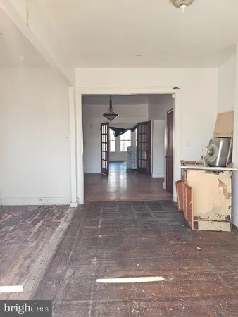 a view of a room with kitchen natural and wooden floor