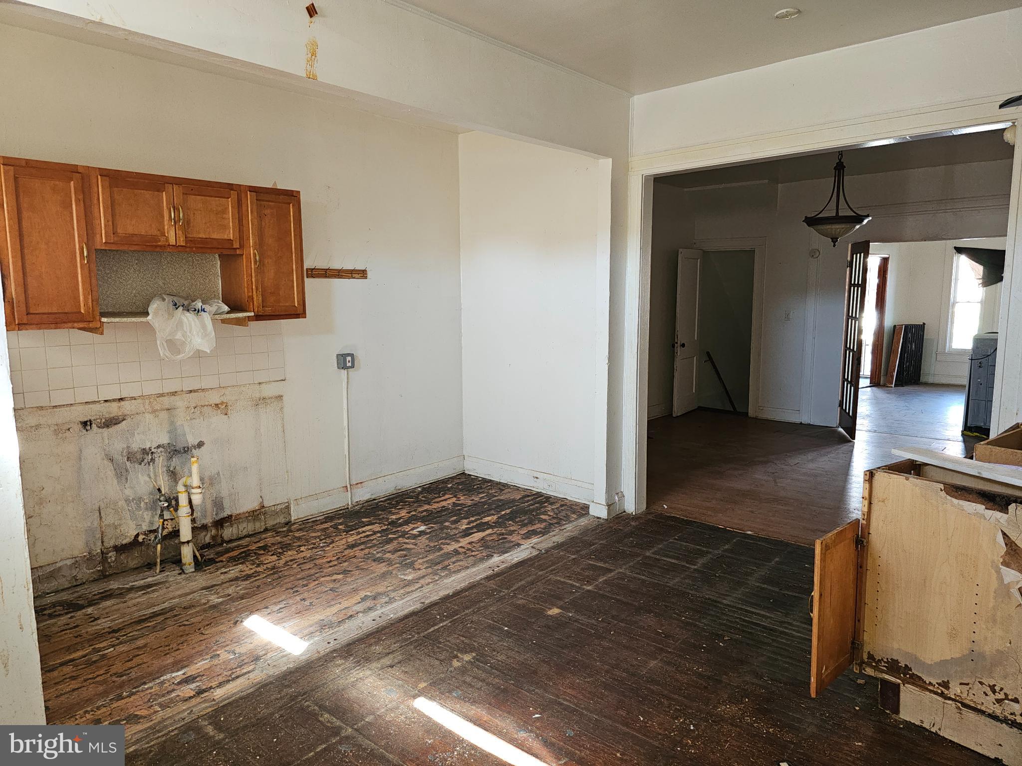3239 Dudley Avenue Baltimore, MD 21213 - Photo 15 of 31 a view of a kitchen from the hallway