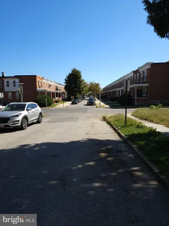a view of street with parked cars