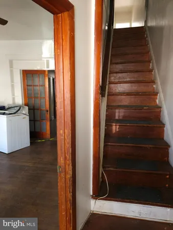 a view of an entryway with wooden floor