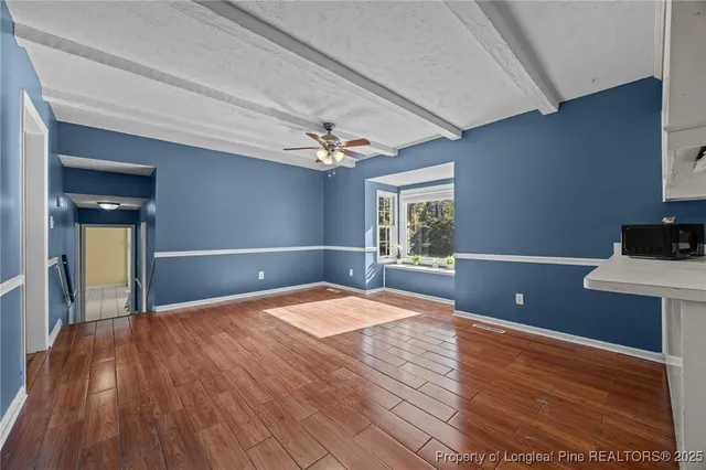 a kitchen with a sink appliances and cabinets