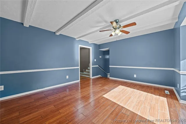 a kitchen with stainless steel appliances a refrigerator and a stove top oven