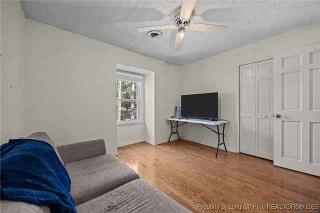 a white toilet sitting next to a bath tub