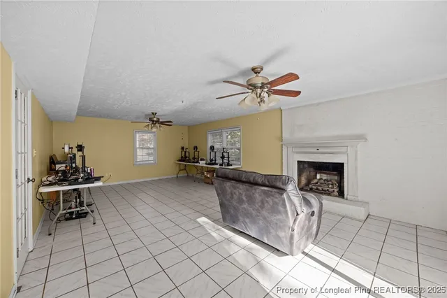 a view of a room with furniture and floor to ceiling window