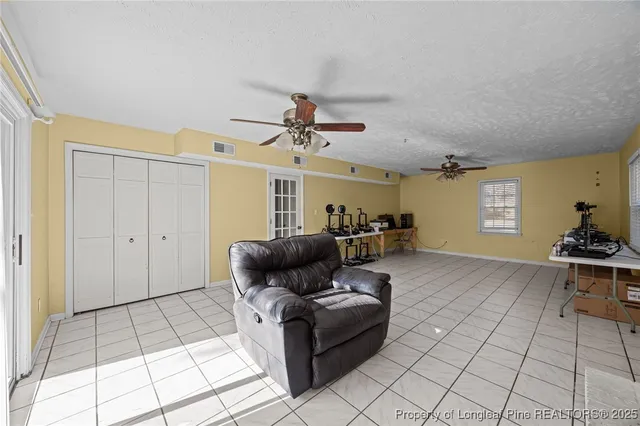 a view of a brick house with large windows