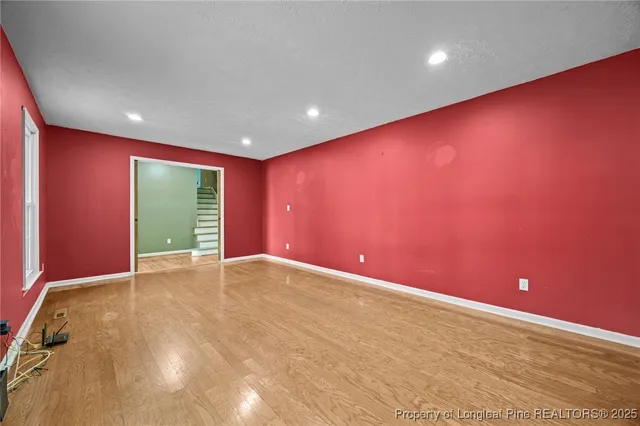 a view of a kitchen with a stove cabinets and wooden floor