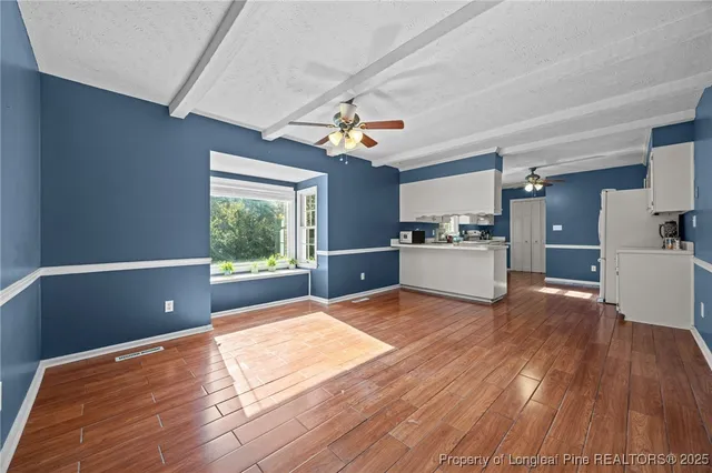 a kitchen with cabinets a sink and appliances