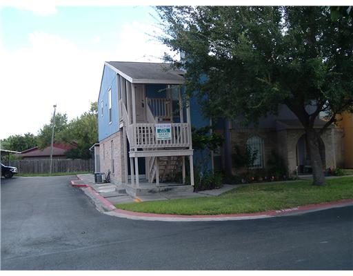 6702 Everhart Road, Unit 108Q Corpus Christi, TX 78413 - Photo 1 of 1 a front view of a house with a yard