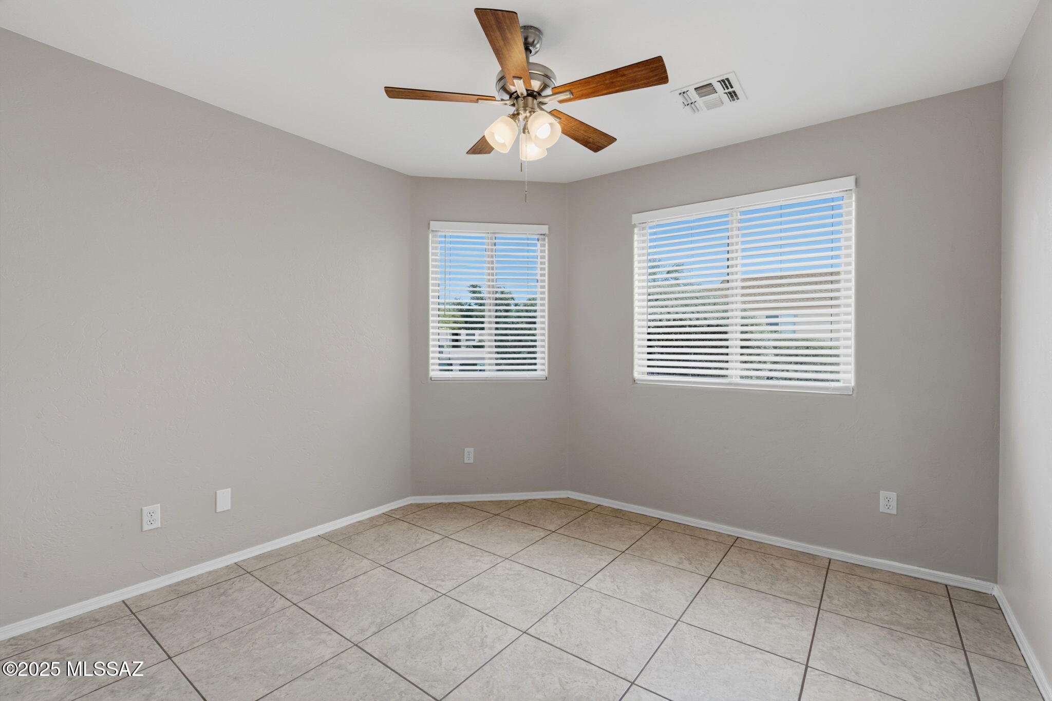 8244 South Lost Mountain Road Tucson, AZ 85747 - Photo 32 of 41 a view of an empty room with a window