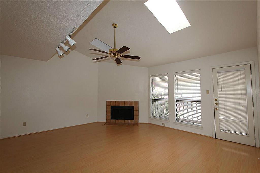 2277 South Kirkwood Road, Unit 708 Houston, TX 77077 - Photo 2 of 13 an empty room with windows and fan