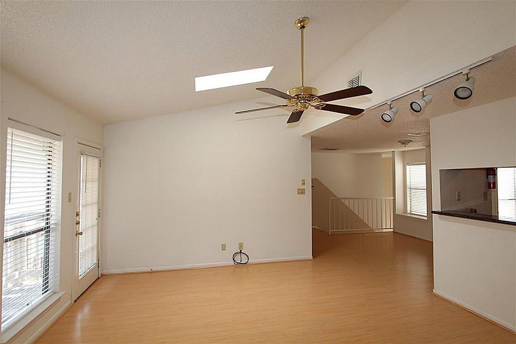 2277 South Kirkwood Road, Unit 708 Houston, TX 77077 - Photo 4 of 13 a view of a livingroom with a flat screen tv and a ceiling fan