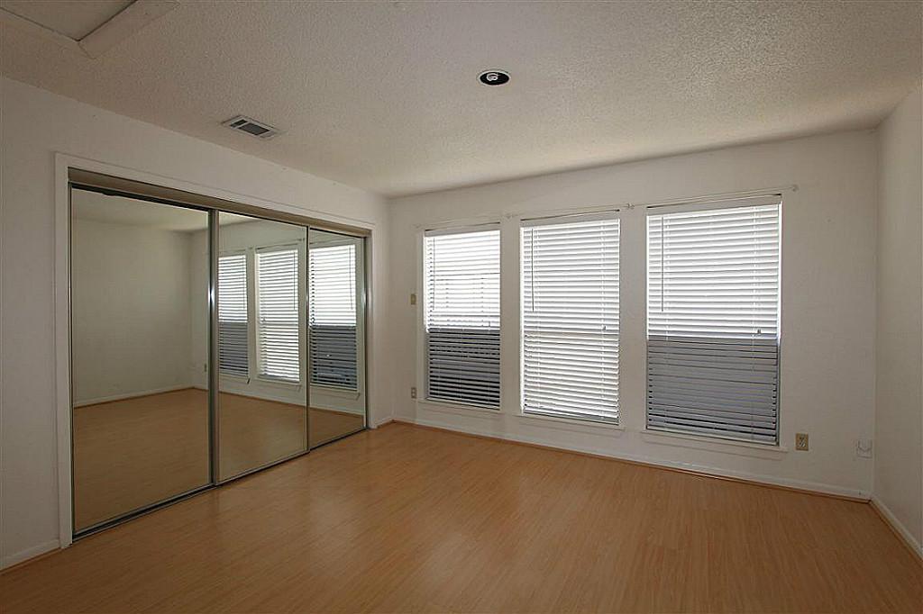 2277 South Kirkwood Road, Unit 708 Houston, TX 77077 - Photo 8 of 13 a view of empty room with floor to ceiling window
