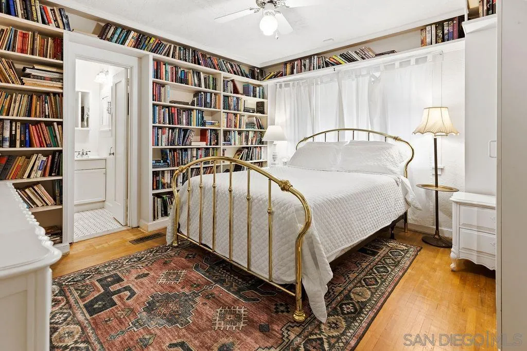 4531 Date Avenue La Mesa, CA 91941 - Photo 14 of 34 a bedroom with a bed and a book shelf