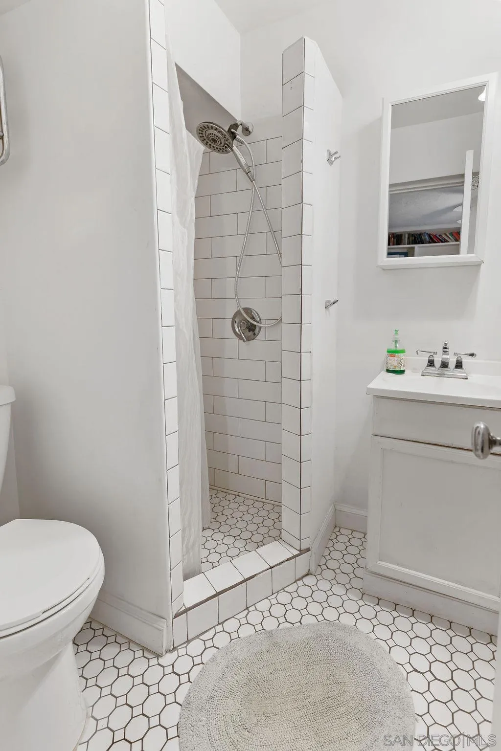 4531 Date Avenue La Mesa, CA 91941 - Photo 17 of 34 a bathroom with a sink toilet and shower