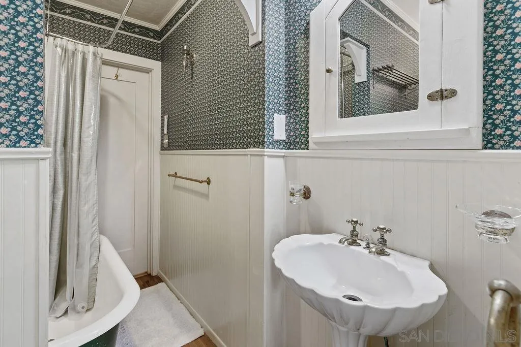4531 Date Avenue La Mesa, CA 91941 - Photo 20 of 34 a bathroom with a sink and mirror