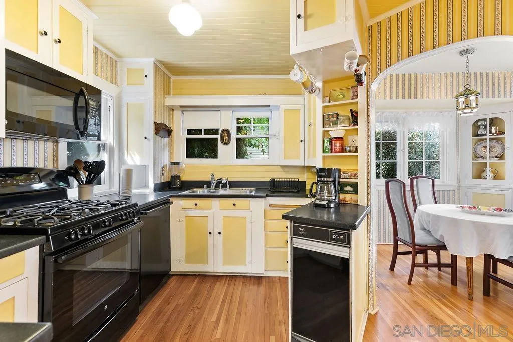 4531 Date Avenue La Mesa, CA 91941 - Photo 3 of 34 a kitchen with stainless steel appliances a stove a sink dishwasher a stove and a microwave oven with cabinets