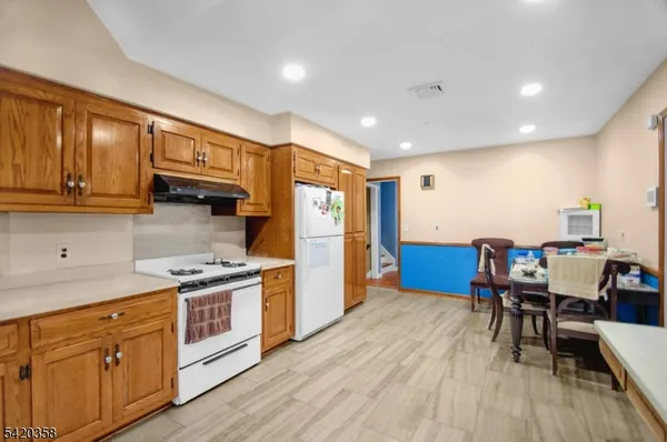 a utility room with sink dryer and washer