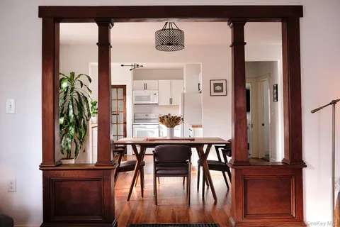 a view of a dining room with furniture and window