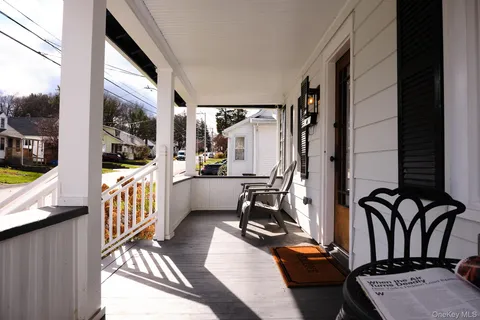 a view of a balcony and chairs