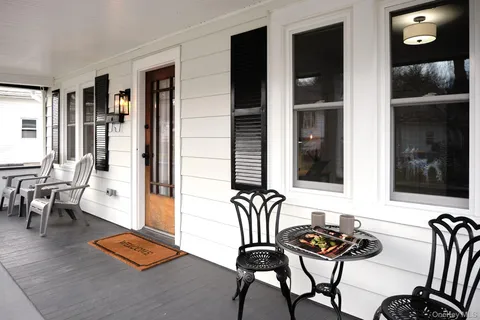 a view of a livingroom with furniture and window