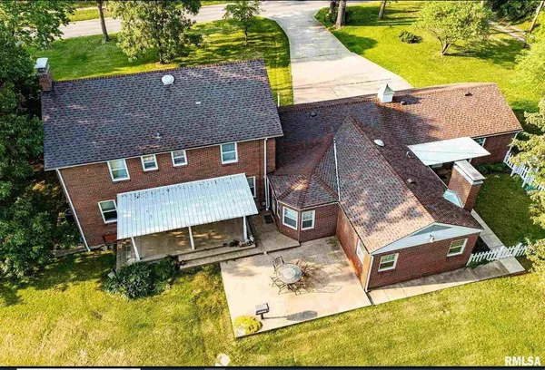 an aerial view of a house with swimming pool