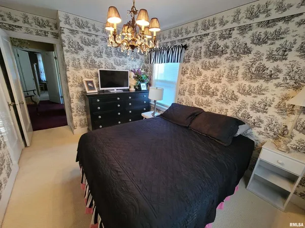 a bathroom with a sink a mirror and a toilet