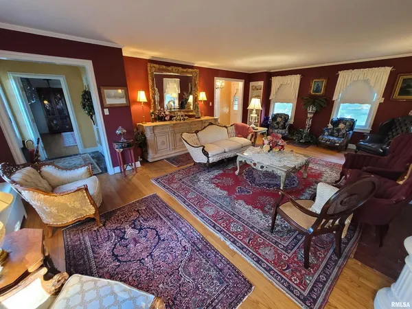 a living room with furniture fireplace and a table