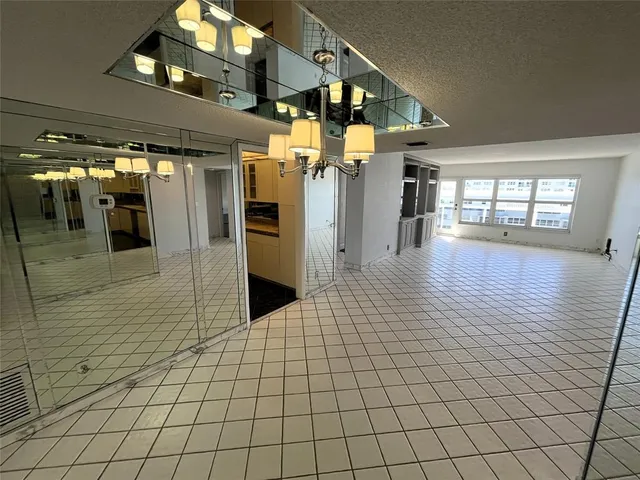 a kitchen with a refrigerator and a sink