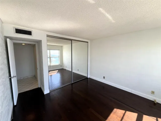 a bathroom with a sink mirror and shower