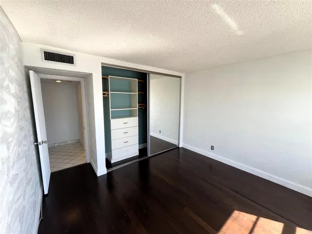 a view of a lake with a building in the background