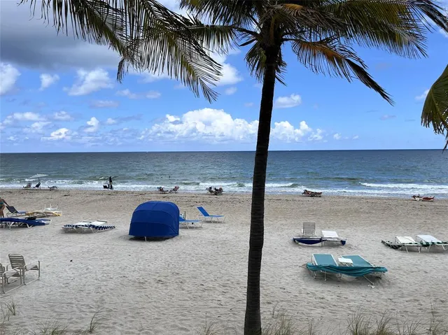 a view of a hallway with chair and piano
